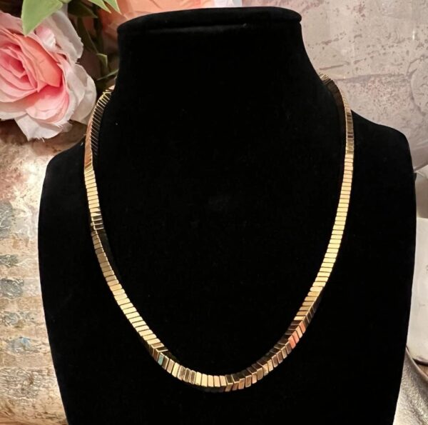 Gold four sided necklace